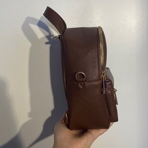 Brown faux leather tiny backpack, matching straps included